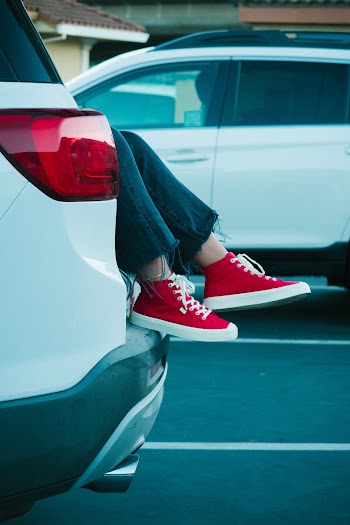 Person in Suv Wearing Red-and-white Shoes