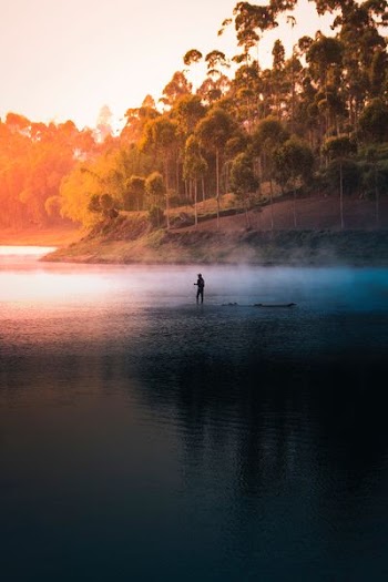 person in the middle of lake