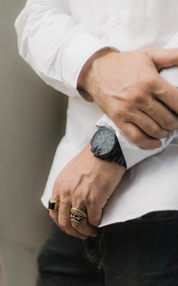 Person in White Dress Shirt Holding their Hand