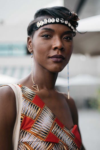 Person in White, Red, and Black Sleeveless Top