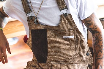 Person In White Top And Brown Dungaree