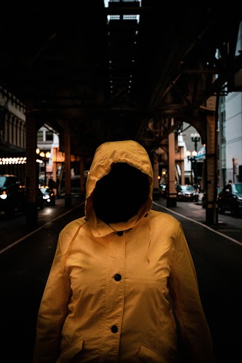 Person In Yellow Hooded Jacket
