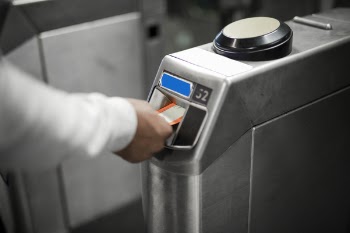 Person Inserting Card In Machine