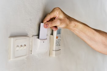 Person Inserting Magnetic Card In Reader