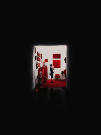 Person Inside A Room Taking Photo