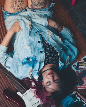 Person Laying Down Wearing Denim Jacket