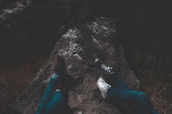 person laying on rock
