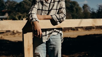 Person Leaning On Fence