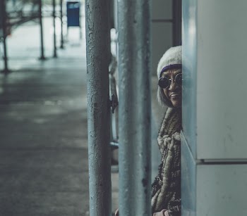 Person Leaning On Wall