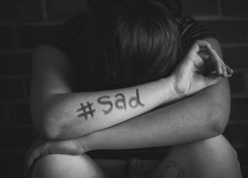 Person Leans on Arms With #sad Text