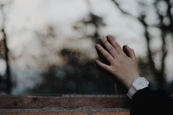 Person Left Hand Touching on Glass