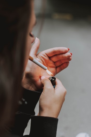 Person Lighting A Cigarette