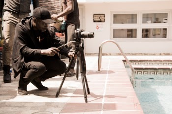 Person Looking at Camera on Tripod