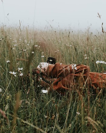Person Lying Down on Grass