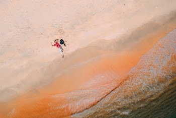 Person Lying Down on Sand
