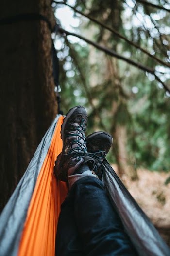 person lying on hammock
