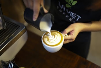 Person Making Cappuccino