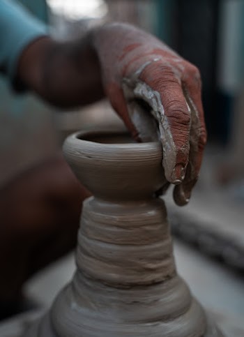 Person Molding a Clay Pot
