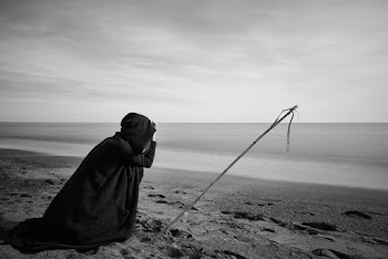 Person Near Seashore Grayscale Photo