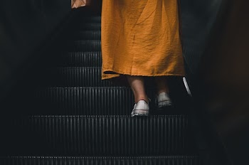 Person on Escalator