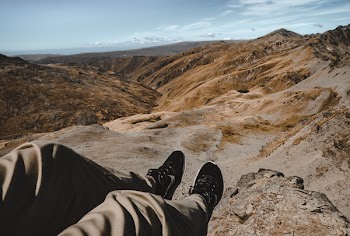 Person on Mountain Ledge