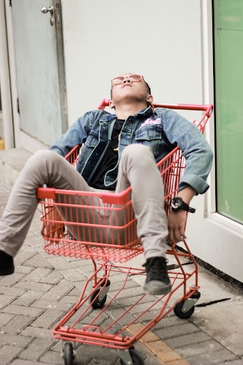 Person on Red Grocery Cart
