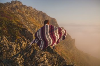 person on top of mountain