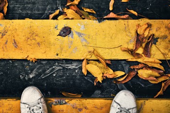 Person on Yellow and Black Surface