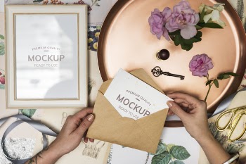Person Opening Brown Envelope With White Invitation Letter