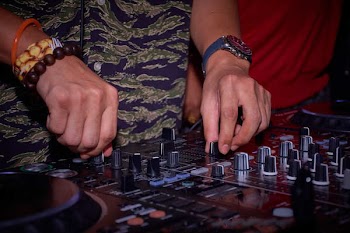 Person Operates Audio Mixer