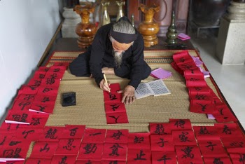 Person Painting Chinese Scripts