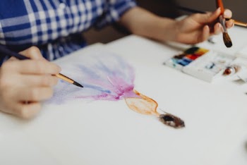 Person Painting Woman in Dress