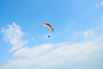 Person Parachuting on Mid Air