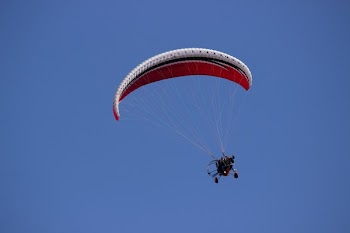 Person Paragliding during Daytime
