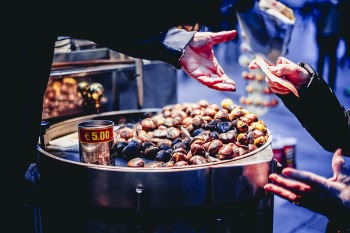 Person Paying Bill in Front of Nuts