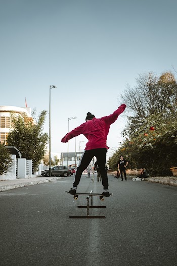 Person Performing Skateboard Stunt