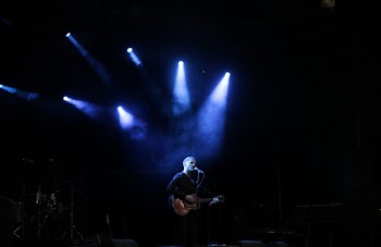 Person Performing With Guitar