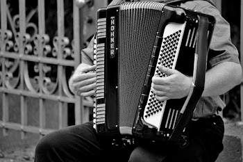 Person Playing a Horner Musical Intrument in Grayscale