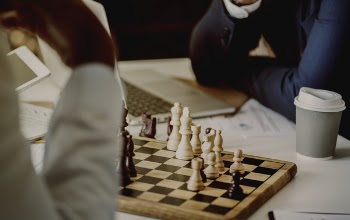 Person Playing Chessboard Set