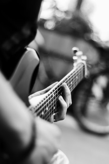 Person Playing Electric Guitar