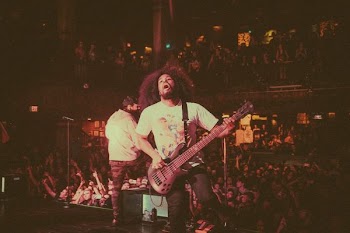 person playing electric guitar