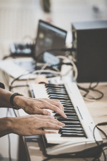 Person Playing Electronic Keyboard