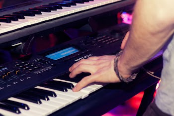 Person Playing Electronic Keyboard