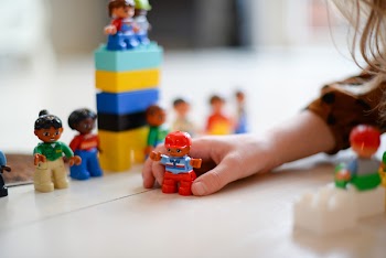 Person Playing Lego Mini Fig