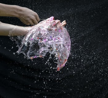Person Playing With Water