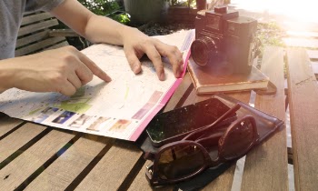 Person Pointing at Map