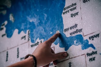 person pointing map