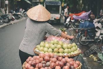 Person Pushing Black Bike