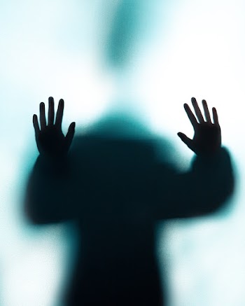 Person Pushing in a Wall Close-up Photography