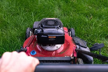 Person Pushing Lawn Mower
